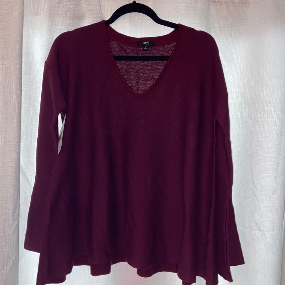 Cute top never worn with bell sleeves